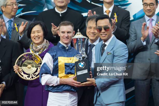 Mr Donnie Yen, BMW Hong Kong Derby Ambassador, presents souvenirs to BMW Hong Kong Derby winning jockey Zac Purton at Sha Tin racecourse on March 15,...