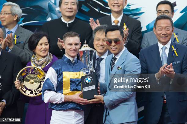 Mr Donnie Yen, BMW Hong Kong Derby Ambassador, presents souvenirs to BMW Hong Kong Derby winning jockey Zac Purton at Sha Tin racecourse on March 15,...