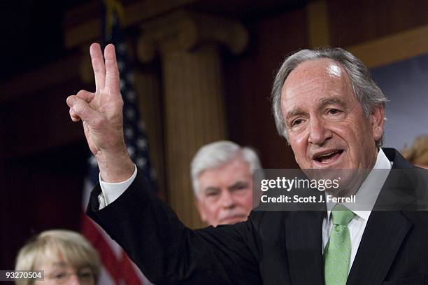 Senate Health, Education, Labor and Pensions Chairman Tom Harkin, D-Iowa, gives a "V for Victory" sign during a news conference after the release of...