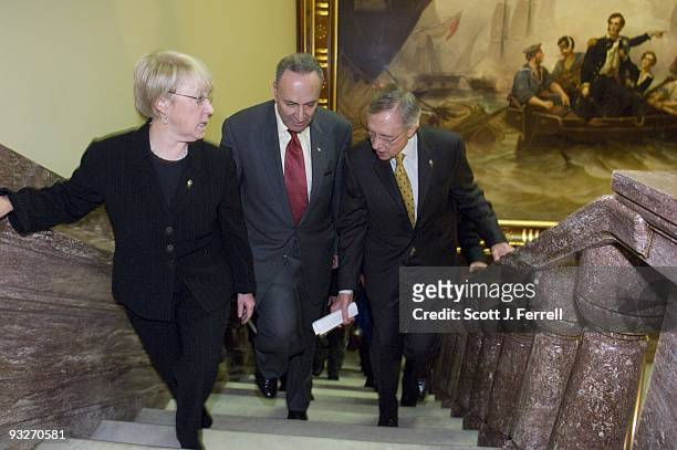Sen. Charles E. Schumer, D-N.Y., Sen. Patty Murray, D-Wash., and Senate Majority Leader Harry Reid, D-Nev., on their way to a news conference after a...