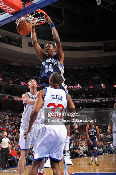 Hasheem Thabeet of the Memphis Grizzlies dunks the ball against Primoz Brezec and Willie Green of the Philadelphia 76ers during the game on November...