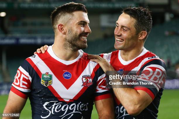 James Tedesco and Cooper Cronk of the Roosters celebrate at full time following the round two NRL match between the Sydney Roosters and the...
