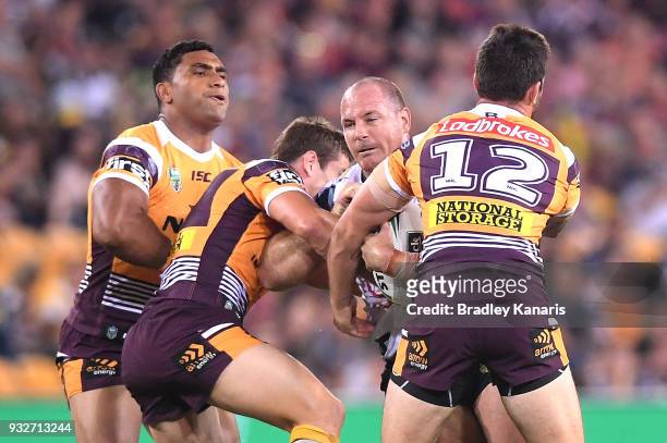 Matthew Scott of the Cowboys takes on the defence during the round two NRL match between the Brisbane Broncos and the North Queensland Cowboys at...