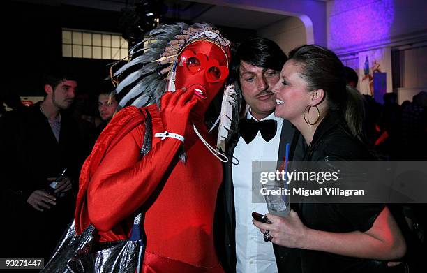 Man in disguise Norbert Schmitz and Dana Schweiger are pictured during the Skyy swap market on November 20, 2009 in Munich, Germany.