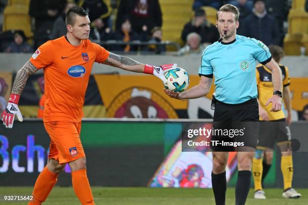 Goalkeeper Kevin Mueller of Heidenheim and Referee Sven Waschitzki gesture during the Second Bundesliga match between SG Dynamo Dresden and 1. FC...