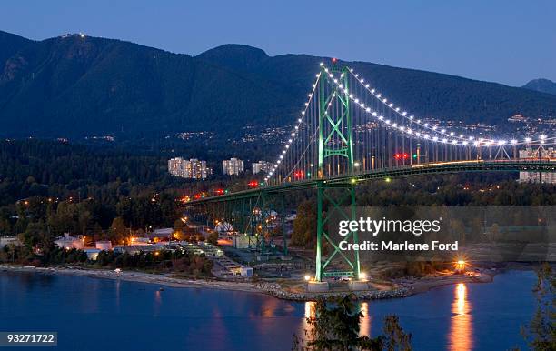 dusk on lions gate bridge, vancouver - vancouver lions gate stock pictures, royalty-free photos & images