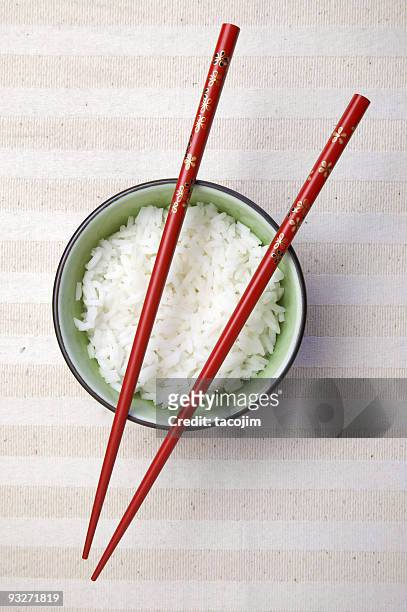 bowl of asian rice with chopsticks ready to use - chopsticks stock pictures, royalty-free photos & images