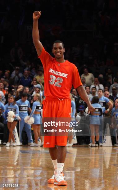 Kris Joseph of the Syracuse Orange celebrates after defeating the North Carolina Tar Heels in the championship game of the 2K Sports Classic on...