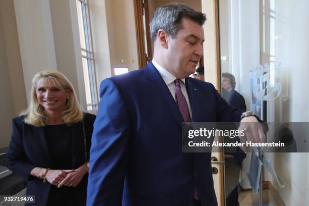 Markus Soeder of the Bavarian Christian Democrats arrives with his wife Karin Soeder at the Bavarian state parliament on March 16, 2018 in Munich,...