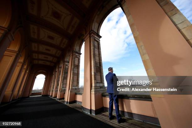 Markus Soeder of the Bavarian Christian Democrats looks over the city of Munich as he arrives at the Bavarian state parliament on March 16, 2018 in...