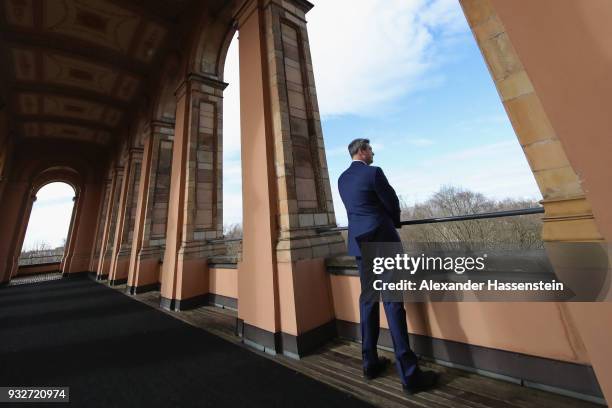 Markus Soeder of the Bavarian Christian Democrats looks over the city of Munich as he arrives at the Bavarian state parliament on March 16, 2018 in...