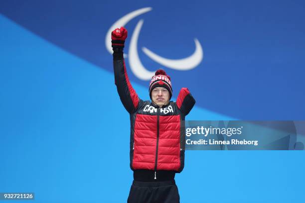 Gold medallist Mark Arendz of Canada celebrates during the medal ceremony for the Men's Biathlon 12.5km Standing on day seven of the PyeongChang 2018...