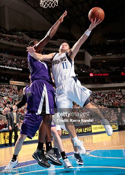 Jose Juan Barea of the Dallas Mavericks goes up for the layup against Jason Thompson of the Sacramento Kings during a game at the American Airlines...