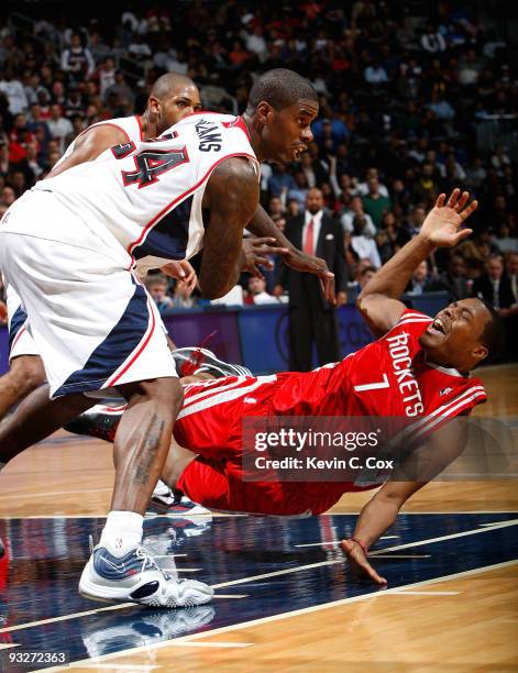 Marvin Williams of the Atlanta Hawks collides with Kyle Lowry of the Houston Rockets at Philips Arena on November 20, 2009 in Atlanta, Georgia. NOTE...