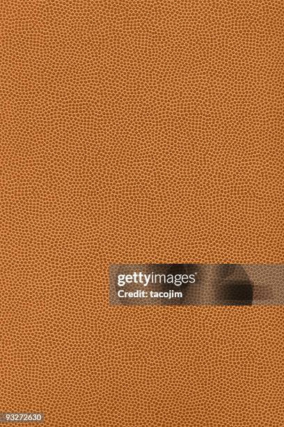 bumpy football texture - football texture stock pictures, royalty-free photos & images