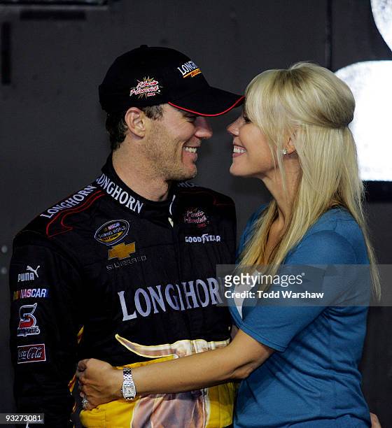Team owner Kevin Harvick and wife DeLana Harvick celebrate winning the Owner's Title in Victory Lane after finishing 8th in the NASCAR Camping World...