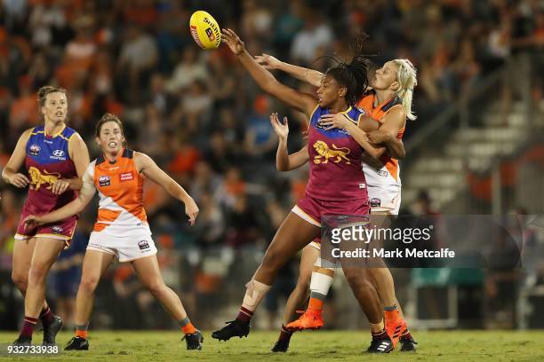 Sabrina Frederick-Traub of the Lions and Renee Tomkins of the Giants compete for the ball during the round seven AFLW match between the Greater...