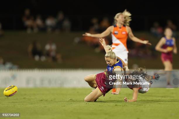 Kate McCarthy of the Lions is tackled by Alicia Eva of the Giants during the round seven AFLW match between the Greater Western Sydney Giants and the...