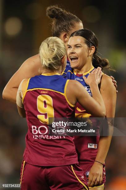 Sophie Conway of the Lions celebrates with team mates after kicking a goal during the round seven AFLW match between the Greater Western Sydney...