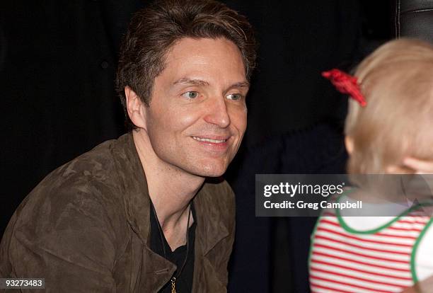 Richard Marx talks with a patient from St. Jude Children's Research Hospital at the annual Elvis Presley lighting celebration at Graceland Plaza on...