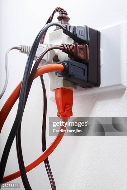 electrical overload - plug socket stock pictures, royalty-free photos & images