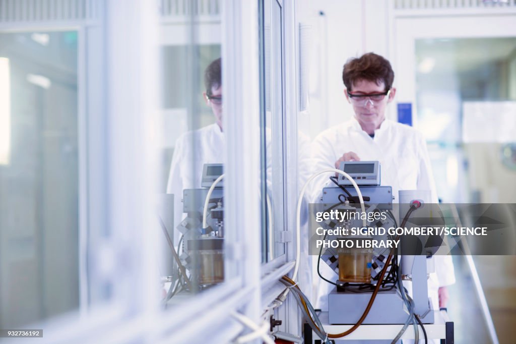 Chemist working with vacuum pump