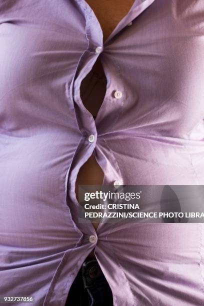woman wearing tight shirt, buttons opening - too small stock pictures, royalty-free photos & images