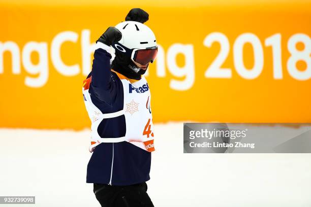 Evan Strong of the United States reacts after competes in the Men's Banked Slalom SB-UL Run 3 during day seven of the PyeongChang 2018 Paralympic...
