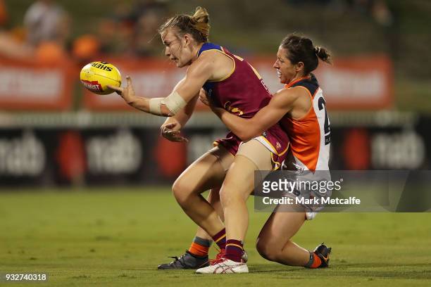 Shannon Campbell of the Lions is tackled by Renee Forth of the Giants during the round seven AFLW match between the Greater Western Sydney Giants and...
