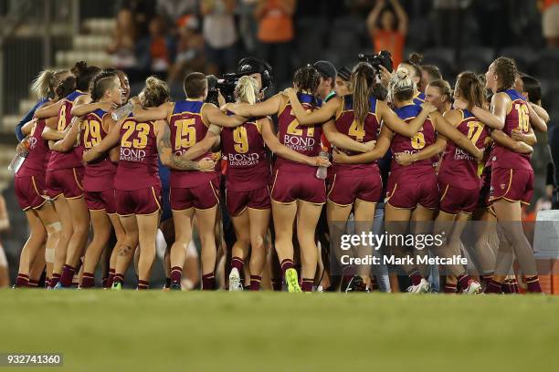 Lions players celebrate victory during the round seven AFLW match between the Greater Western Sydney Giants and the Brisbane Lions at Blacktown...