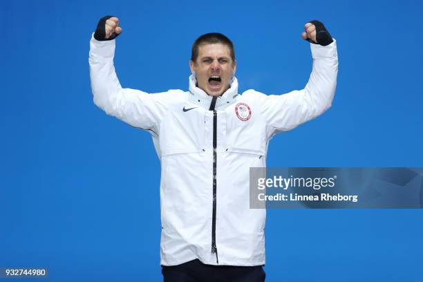 Silver medallist Evan Strong of USA celebrates during the medal ceremony for the Men's Snowboard Banked Slalom SB-LL2 Final on day seven of the...