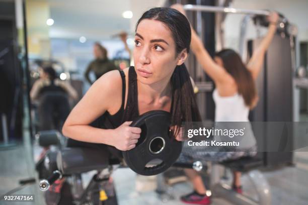 roman bench work out - group of people flexing biceps stock pictures, royalty-free photos & images