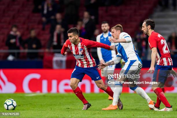 Angel Correa of Atletico de Madrid battles for the ball with Raul Garcia Carnero, Raul C, of CD Leganes during the La Liga 2017-18 match between...