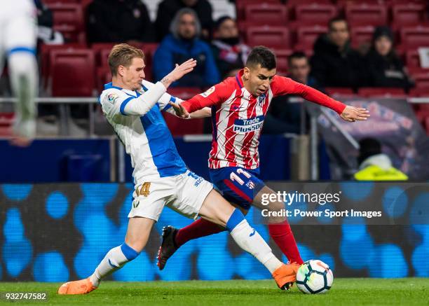 Angel Correa of Atletico de Madrid competes for the ball with Raul Garcia Carnero, Raul C, of CD Leganes during the La Liga 2017-18 match between...