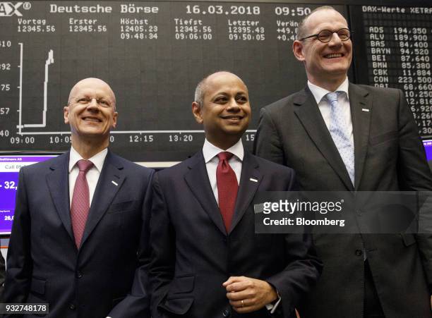 Ralf Thomas, chief financial officer of Siemens AG, left, Michael Sen, chairman of Siemens Healthineers AG, center, and Bernd Montag, chief executive...