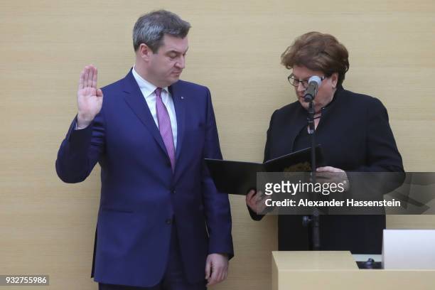 Markus Soeder of the Bavarian Christian Democrats takes his oath during the swearing-in of the new governor of Bavaria at the Bavarian state...