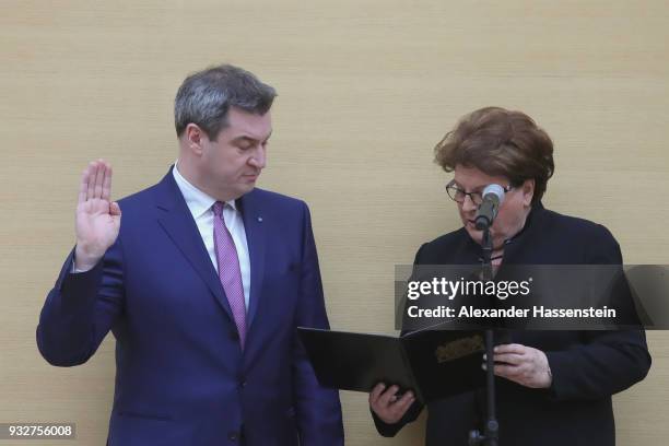 Markus Soeder of the Bavarian Christian Democrats takes his oath during the swearing-in of the new governor of Bavaria at the Bavarian state...