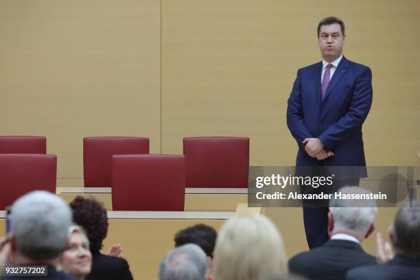 Markus Soeder of the Bavarian Christian Democrats receives applause from colleagues following his election to governor of Bavaria at the Bavarian...