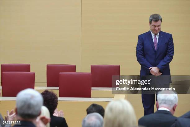 Markus Soeder of the Bavarian Christian Democrats receives applause from colleagues following his election to governor of Bavaria at the Bavarian...