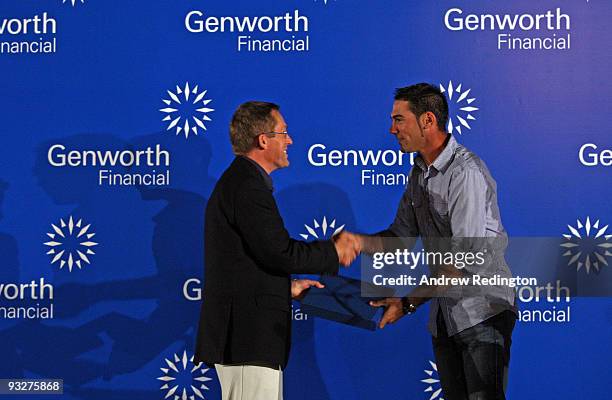 Alvaro Quiros receives his Driving Distance Award from Peter Barrett, MD of Genworth, at the Genworth Financial Statistics Awards after the second...