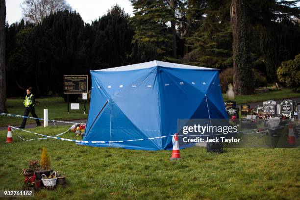 Forensics tent sits over the grave of former Russian double agent Sergei Skripal's son Alexander in London Road cemetery on March 16, 2018 in...
