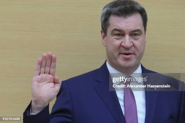 Markus Soeder of the Bavarian Christian Democrats takes his oath during the swearing-in of the new governor of Bavaria at the Bavarian state...