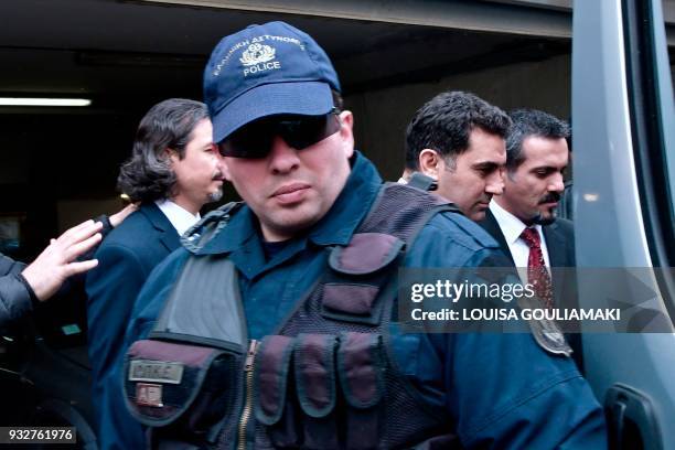 Greek police escort Turkish officers, wanted by Turkey over the July 2016 attempted coup against Turkish President, after their hearing at the appeal...