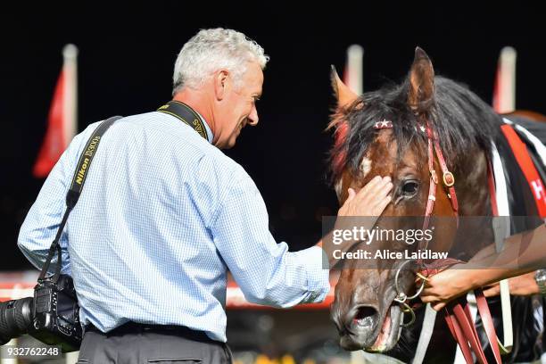 Part owner Brett Holburt with Cliff's Edge after winning the Hacer Group Alister Clark Stakes at Moonee Valley Racecourse on March 16, 2018 in Moonee...