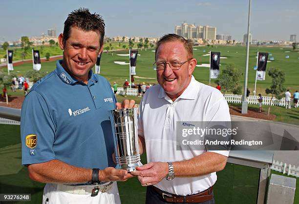 Lee Westwood of England receives his European Tour Shot of the Month Award for October from Richard Hills of The European Tour prior to the start of...