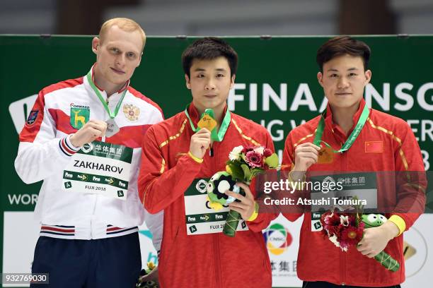 Llia Zakharov of Russia , Yuan Cao of China and Siyi Xie of China pose on the podium after the Men's 10m Platform final during day two of the FINA...