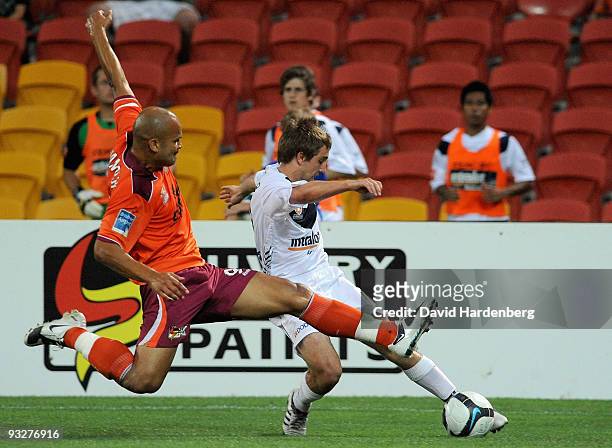 Sergio Van Dijk of the Roar and Evan Berger of the Victory compete for the ball during the round 15 A-League match between the Brisbane Roar and the...