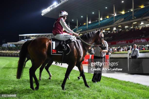 Jamie Mott returns to the mounting yard aboard Cliff's Edge after winning the Hacer Group Alister Clark Stakes at Moonee Valley Racecourse on March...