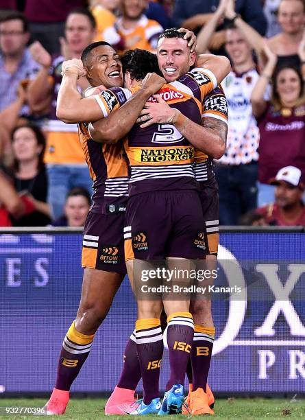 Jamayne Isaako, James Roberts and Darius Boyd of the Broncos celebrate victory after the round two NRL match between the Brisbane Broncos and the...