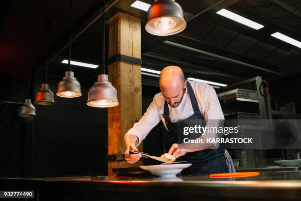 chef cooking in restaurant - madrid food stock pictures, royalty-free photos & images